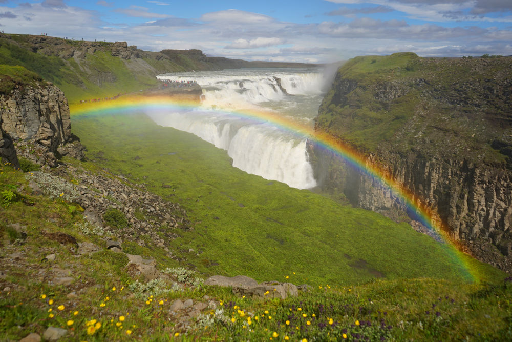 The Golden Circle with a Rainbow in front