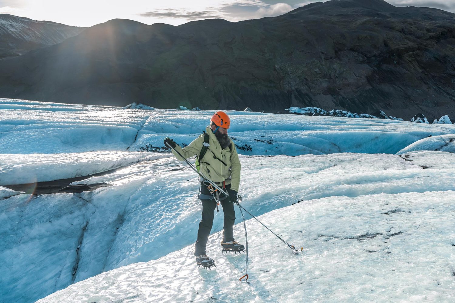 A man working with slings on glacier