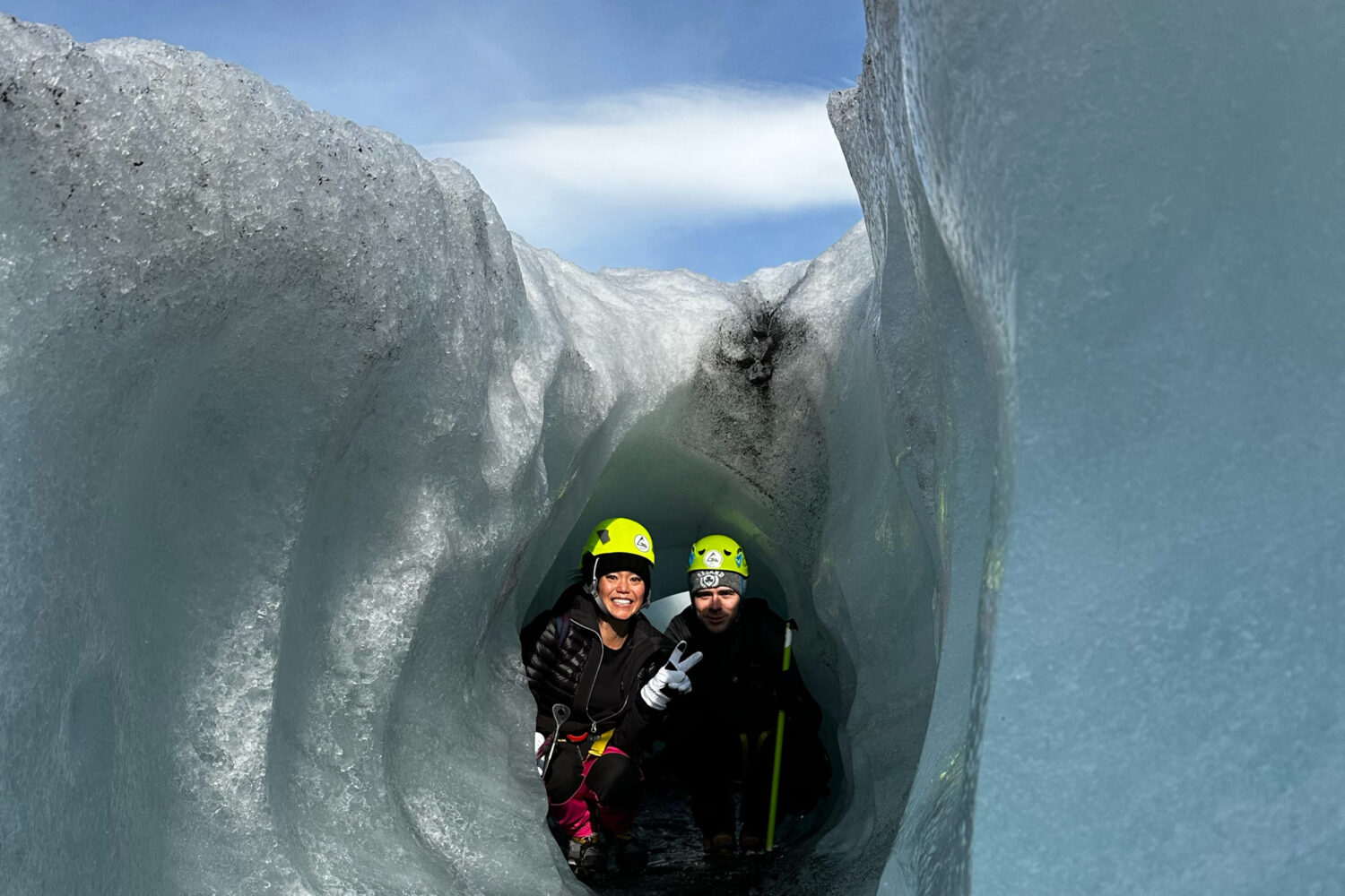 People in a crevasse for a cool photo on the glacier