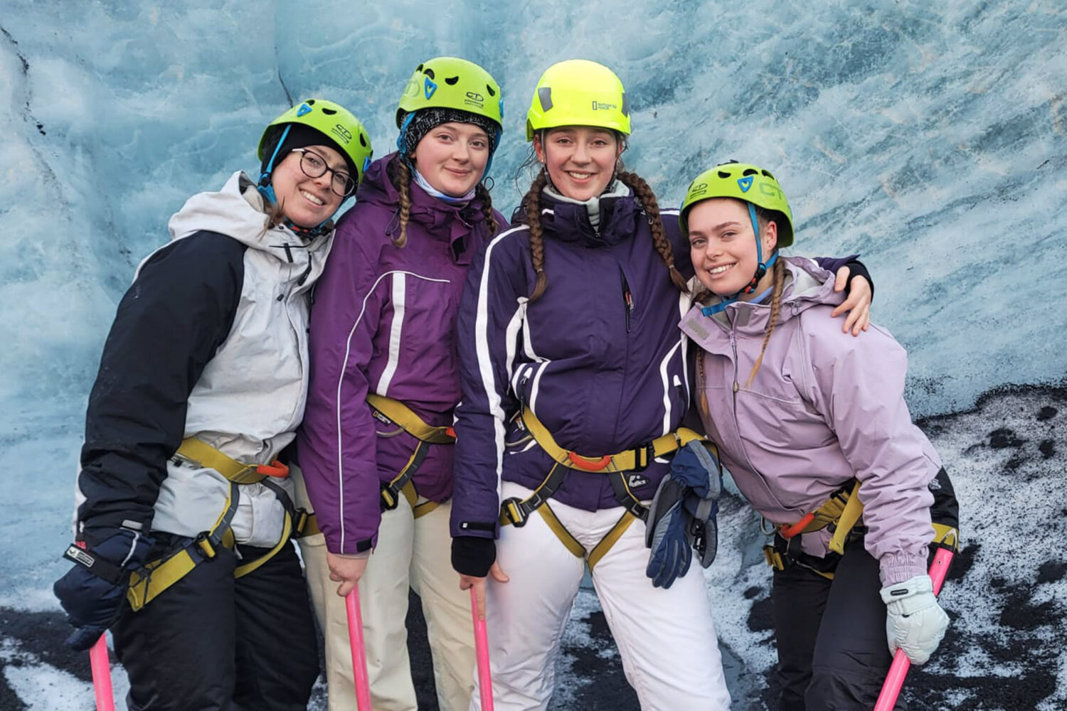 Four girls pose for a photo shoot on the glacier