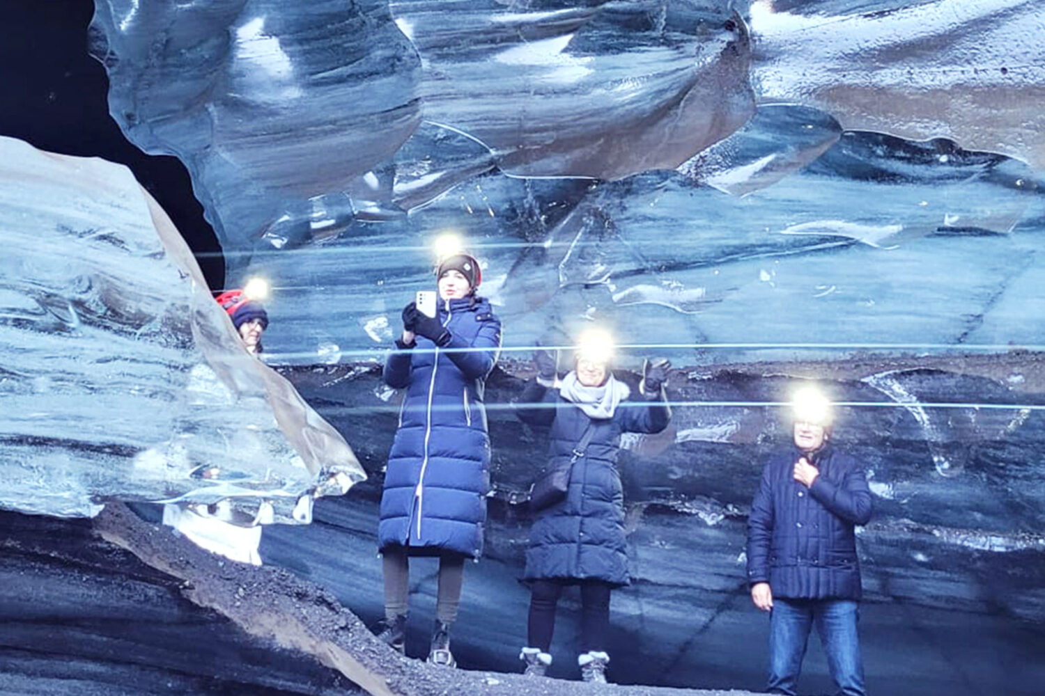 People deep inside a glacier