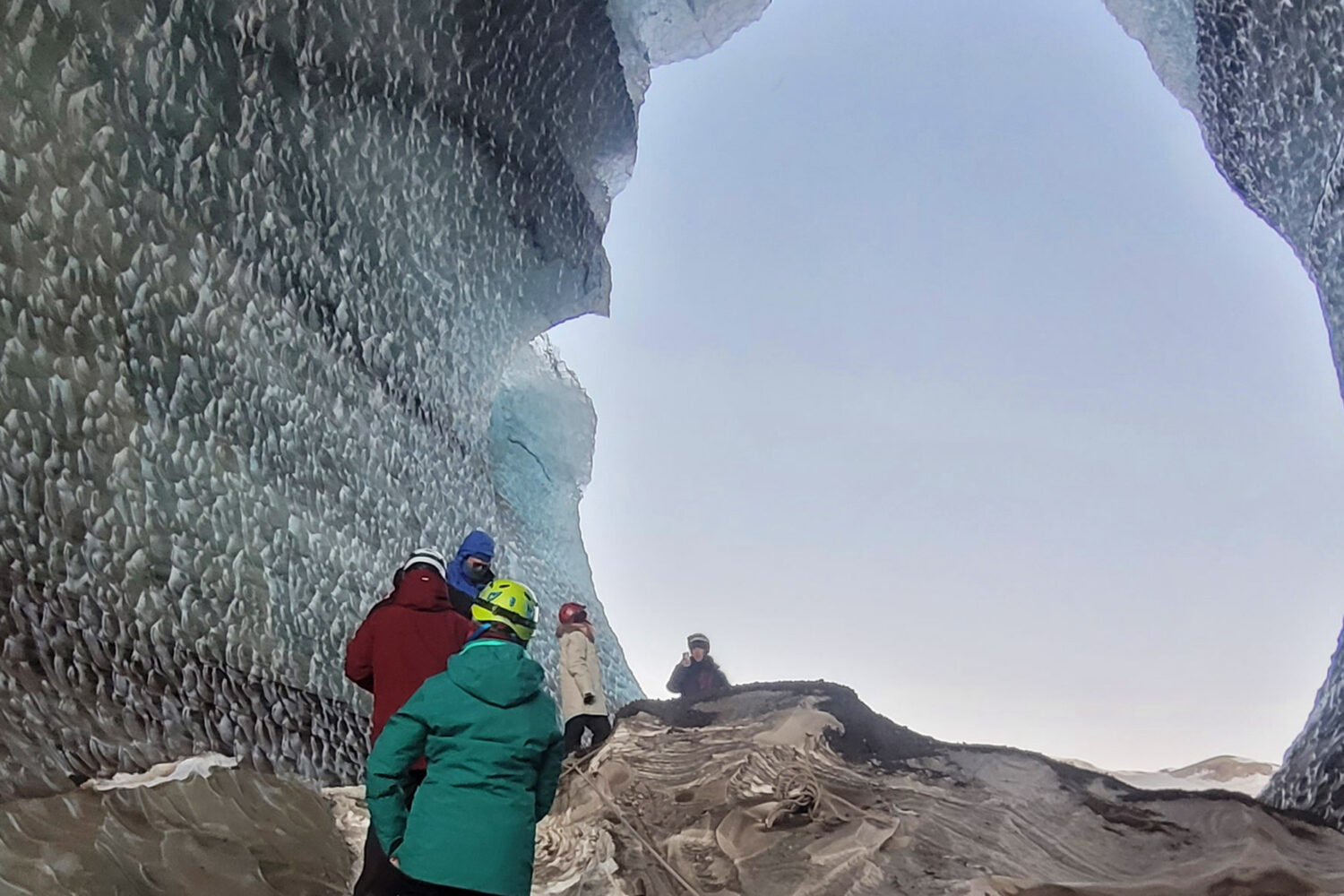 People inside an ice cave.